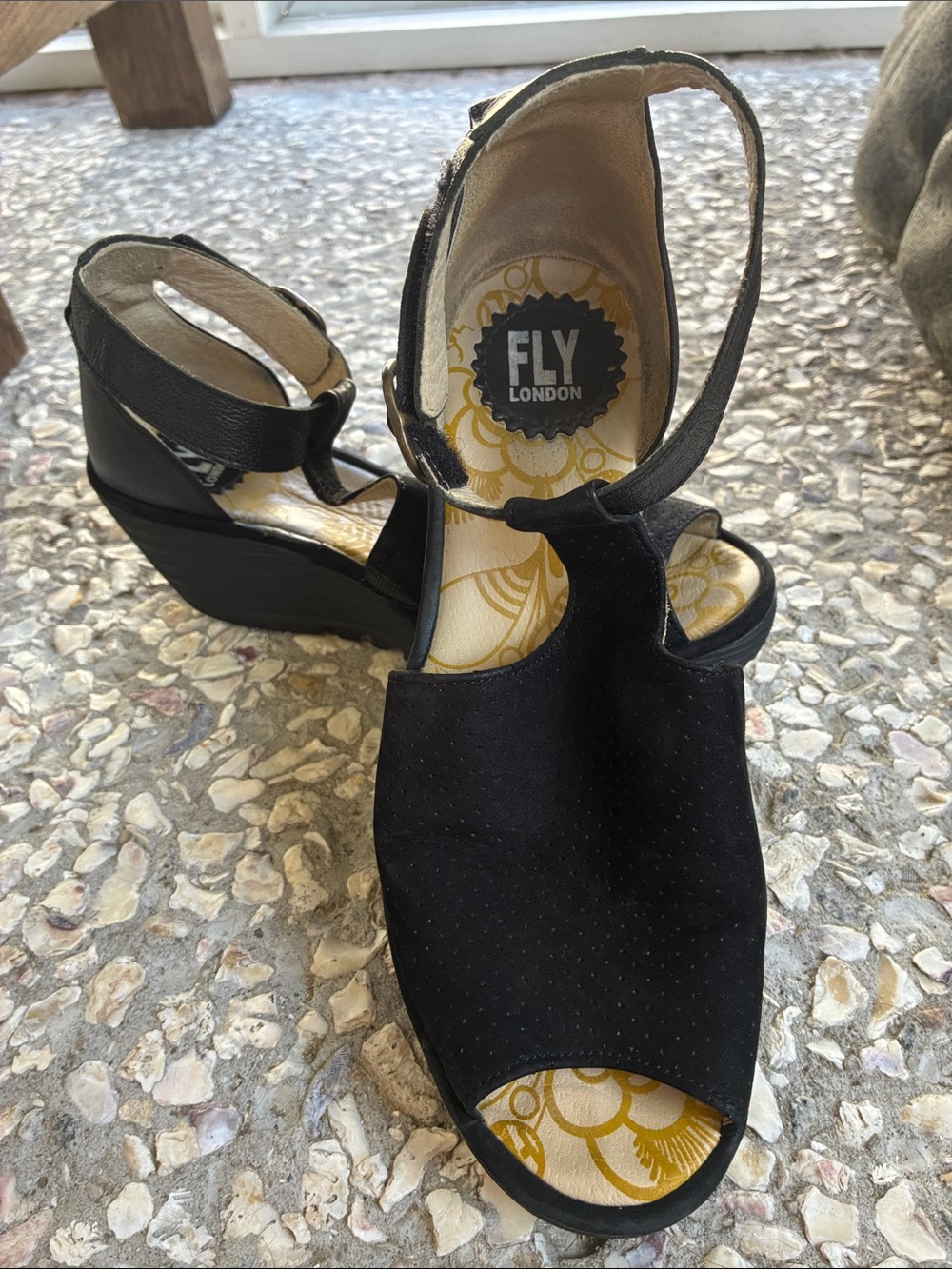Fly London Black Suede Peep-Toe Wedge Sandals, with faux buckle velcro closure.